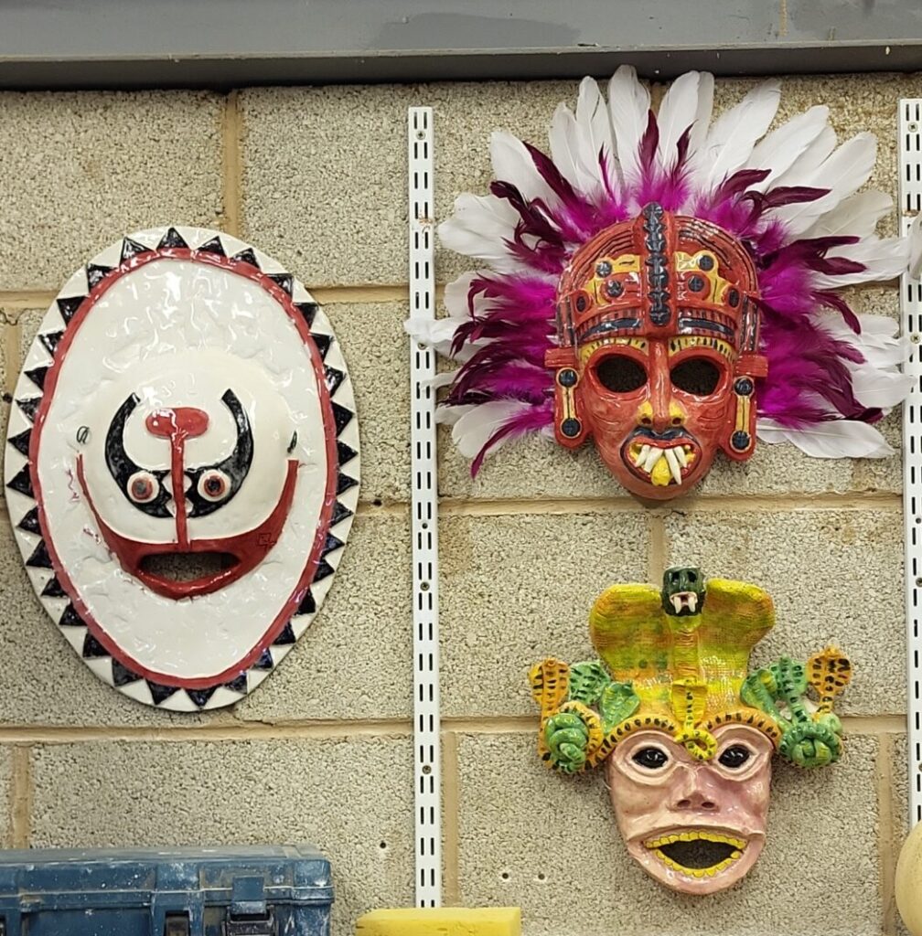 Masks on a studio wall